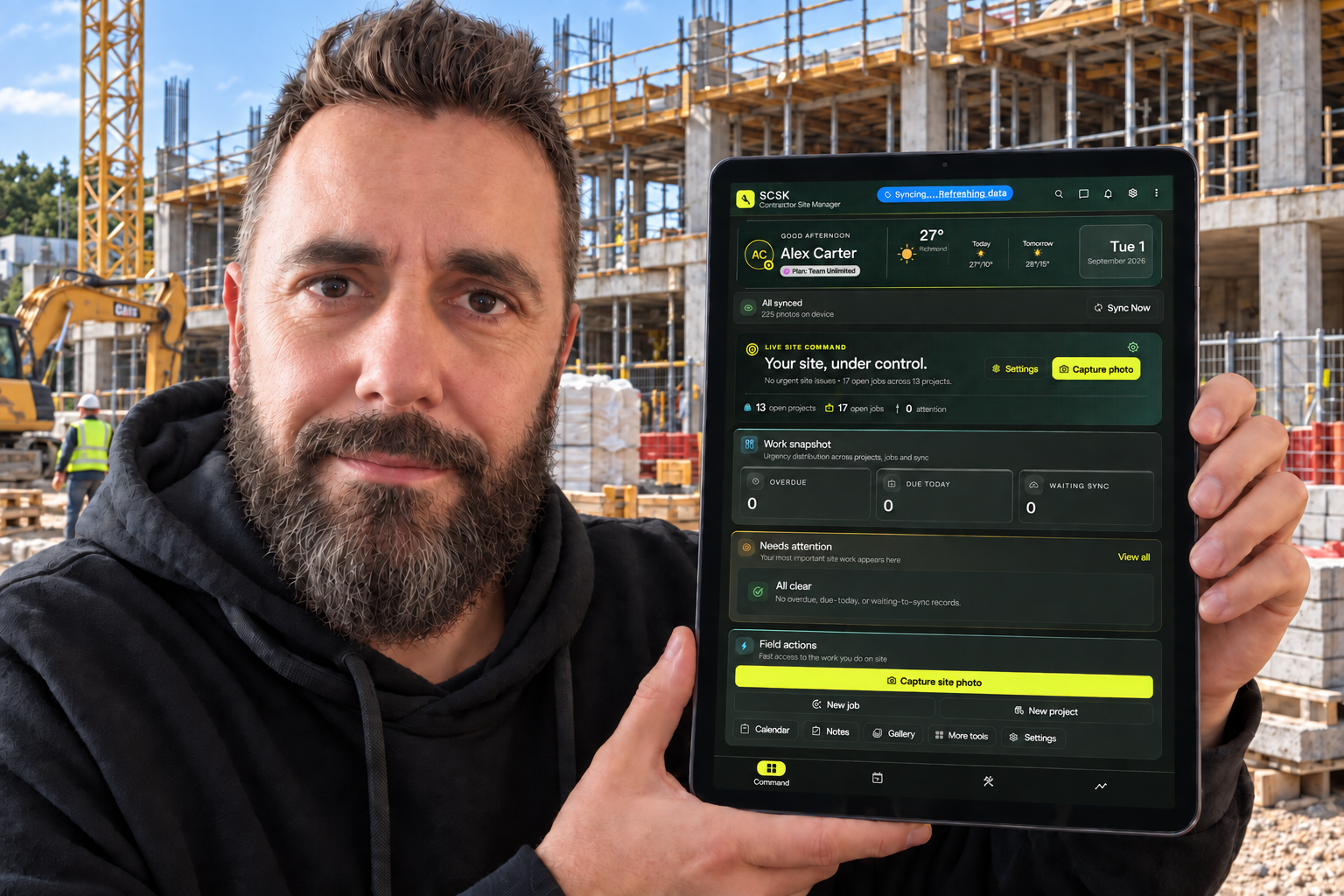 SCSK dashboard on a tablet held at a construction site
